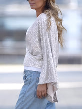 Load image into Gallery viewer, Tied Sequin Surplice Flare Sleeve Blouse
