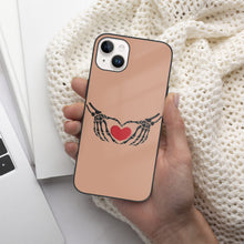 Load image into Gallery viewer, Ti Amo I love you - Exclusive Brand - Feldspar - Skeleton Hands with Heart  - iPhone 14 Glass Case (2 cameras)
