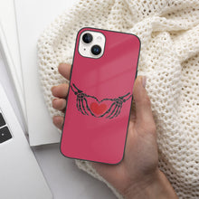 Load image into Gallery viewer, Ti Amo I love you - Exclusive Brand - Viva Magenta - Skeleton Hands with Heart  - iPhone 14 Glass Case (2 cameras)
