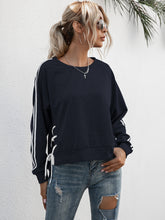 Load image into Gallery viewer, Lace-Up Round Neck Long Sleeve Sweatshirt
